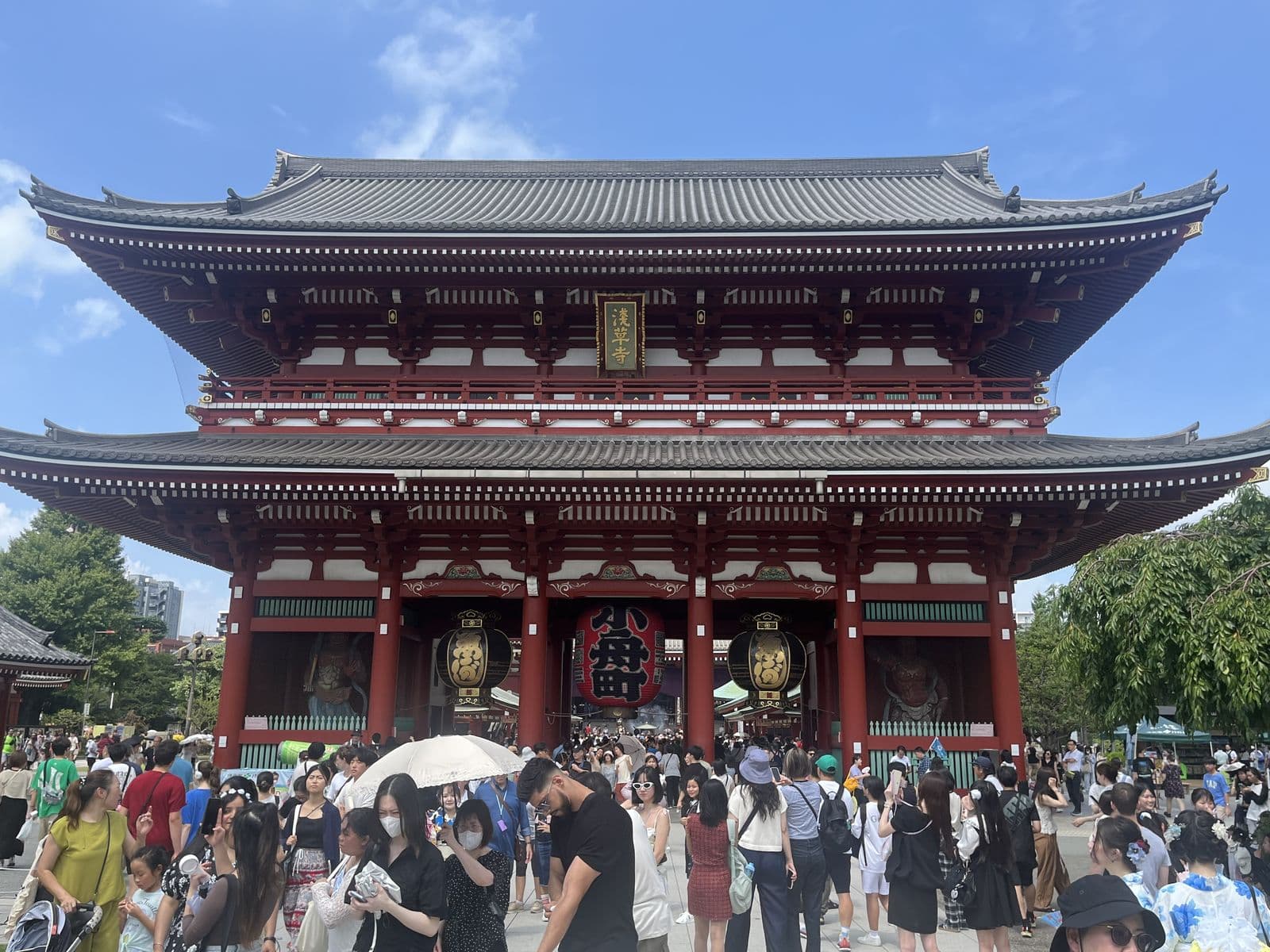 Historic Japanese temple with traditional architecture and autumn trees