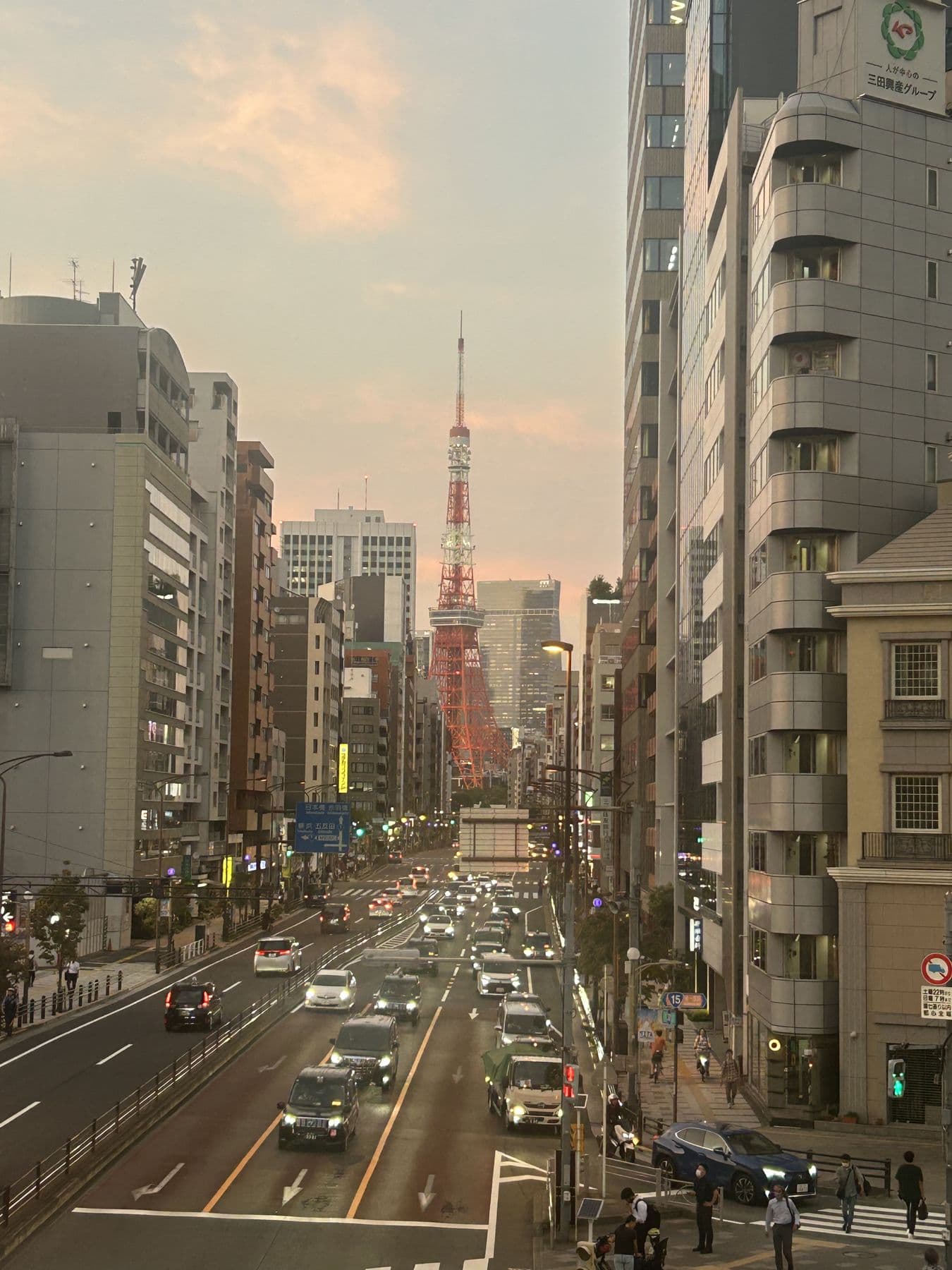 Tokyo Tower down a Tokyo avenue at dusk