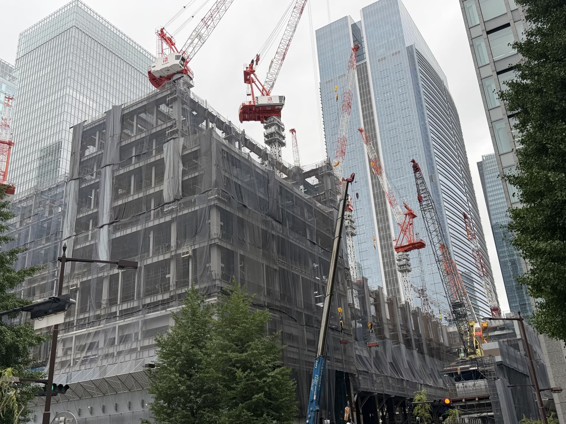 High-rise construction in central Tokyo — cranes over a new office tower